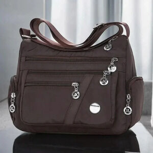 Brown and Silver Crossbody Bag with Adjustable Straps and Zippered Compartments